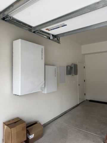Battery and control equipment installed in a garage.